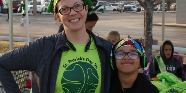 mother and daughter wearing matching neon shirts
