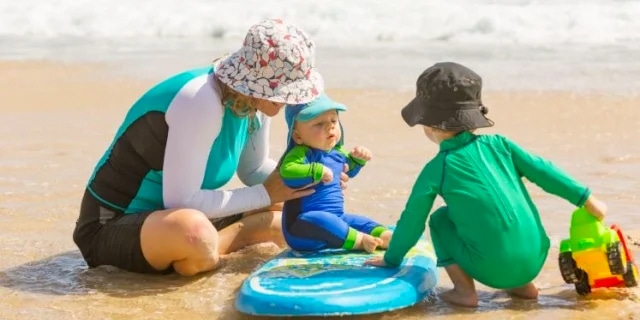 mother and two children at the beach